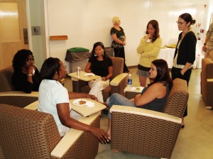 Interns and research staff relax in the casual gathering area in the front lobby. 